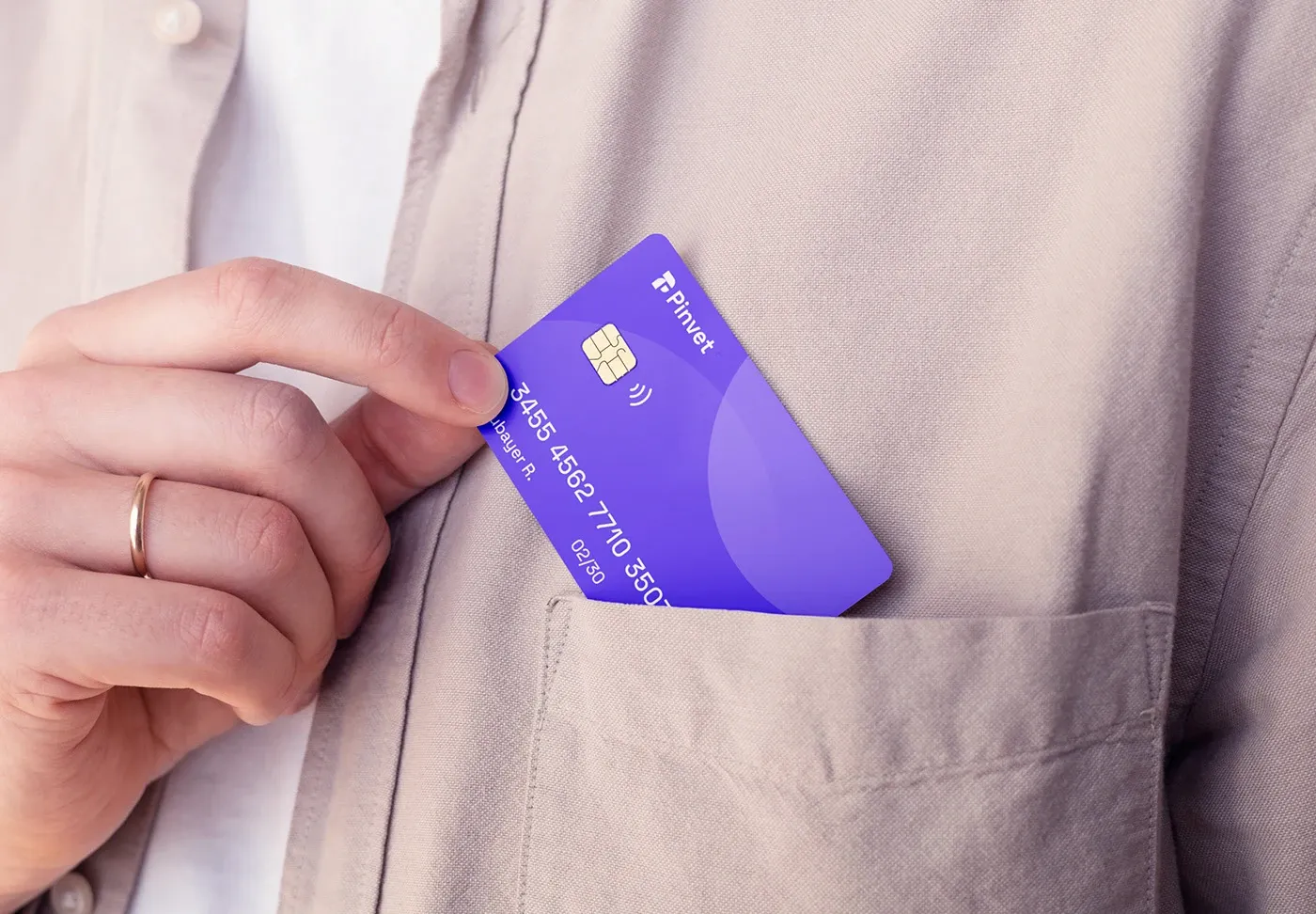 Purple payment card slipped into a shirt pocket