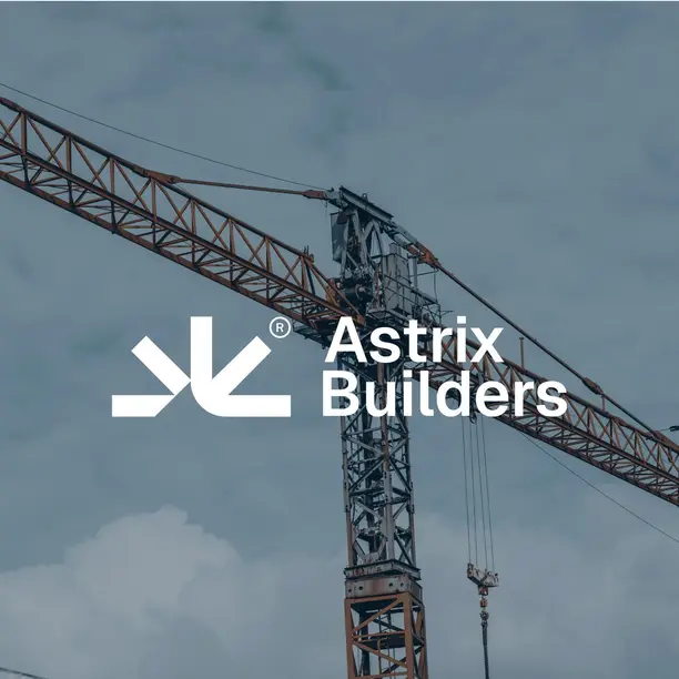 Astrix Builders logo over a construction crane
